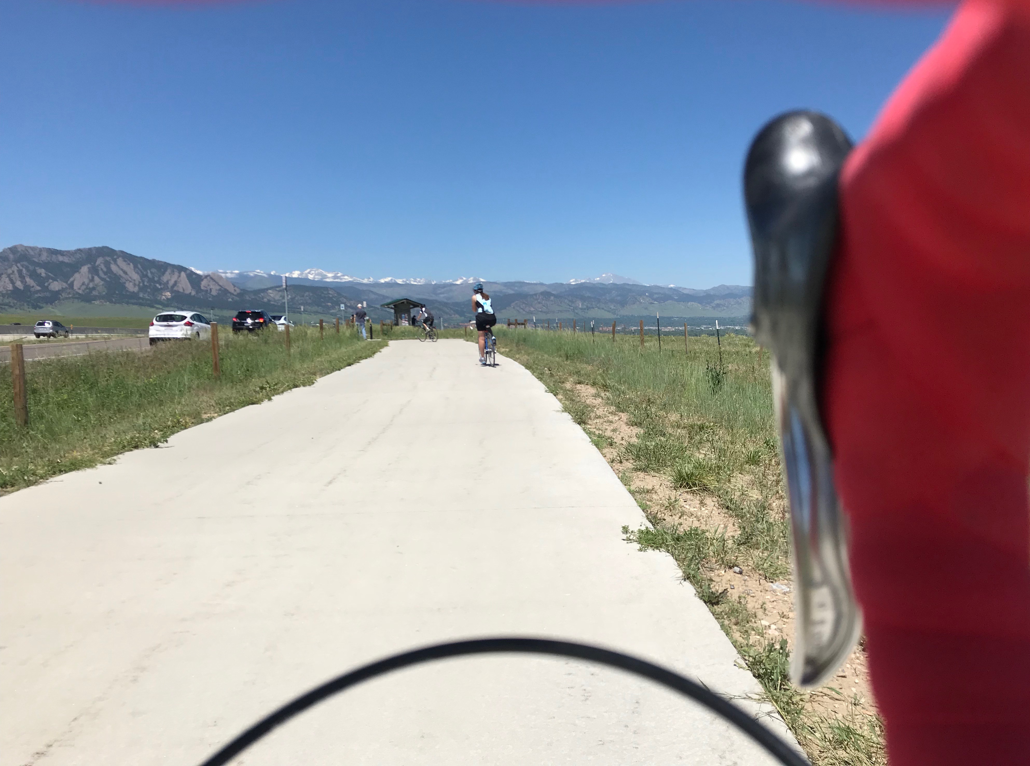 The front range behind Boulder with bike handlebars in the foreground to the right