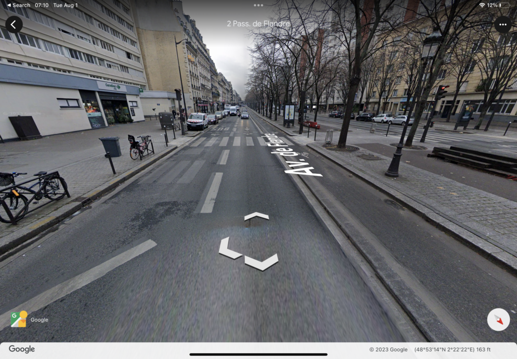 Google Street view of a mid-block crossing on Avenue de Flandre in Paris.